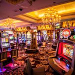A vibrant casino interior with various slot machines and decorative lighting.
